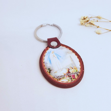 Load image into Gallery viewer, Apparitions of Our Lady of Fatima Leather Keychain
